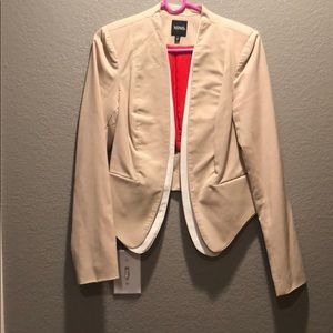 tan and white blazer